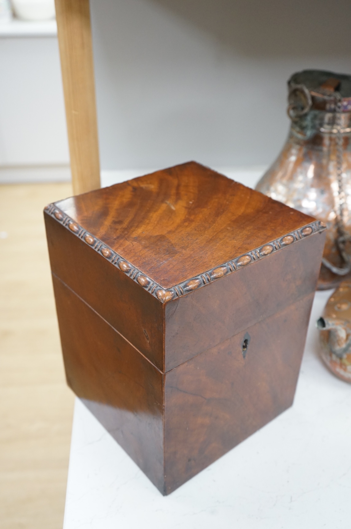 A George III mahogany four bottle decanter box, 26cm